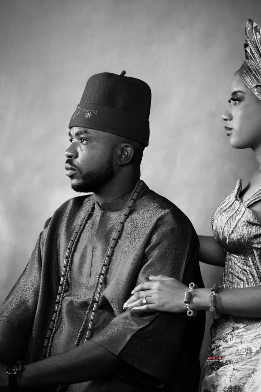 A group photo of the bridal train/friends in uniform traditional attire.