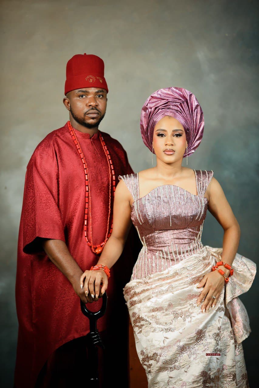 A picture of the couple cutting a traditional wedding cake or meal.